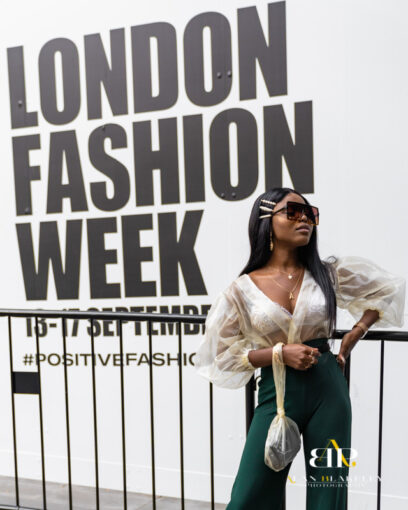 A model standing out side the London Fashion Week Show Feb 2020. Wearing a cream hat and tan leather coat.